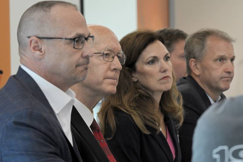 At a round table discussion Thursday concerning the recently passed Big Beautiful Bill Act, from left, DuPage County Board member Greg Schwarz, Congressman Bill Foster, NIFB President and CEO Julie Yukro and Congressman Sean Casten listen to John Murphy, Executive Dir. of Stone Soup Sharing Center in Marengo, talk about the fear of losing clients at the Northern Illinois Food Bank in Geneva on Thursday, July 10, 2025.
