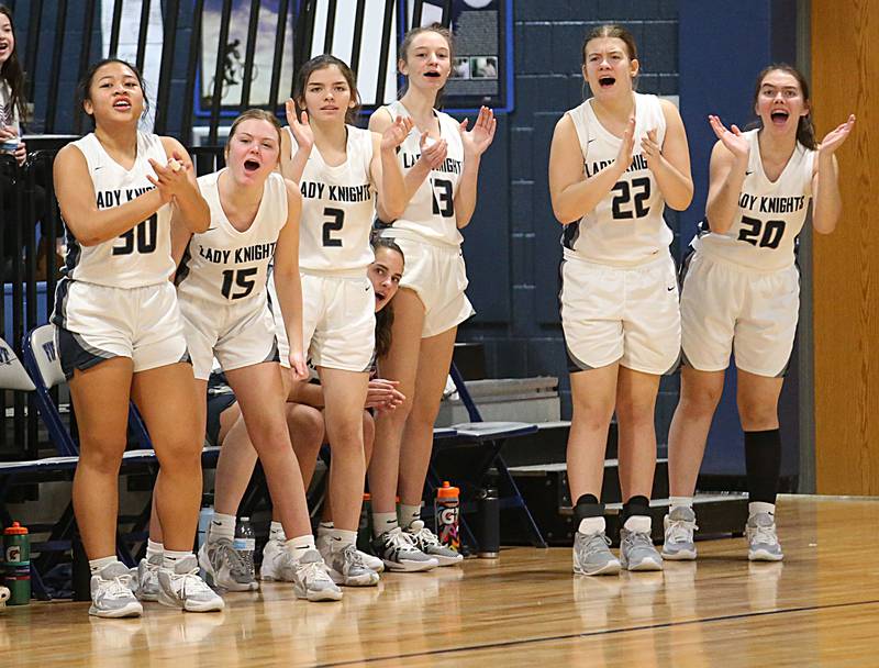 Members of the Fieldcrest girls basketball team cheer on their teammates against Eureka on Monday, Jan. 9, 2023 at Fieldcrest High School.