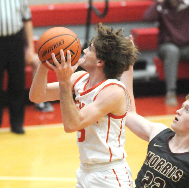 Ottawa's Aiden Mucci shoots past Morris' Gage Phillips in Kingman Gym on Friday, Dec. 2, 2022 in Ottawa.