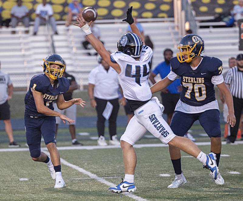 St. Francis’ Andrew Bucaro knocks down Sterling’s Joseph Holcomb’s pass Friday, Sept. 1, 2023 at Sterling High School.