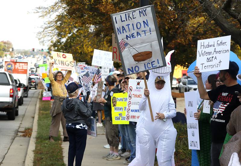 Protesters line Route 31 during a "No Kings” protest rally on Saturday, Oct. 18, 2025, in McHenry. The protest drew thousands of protesters to the area to protest the policies of President Donald Trump.