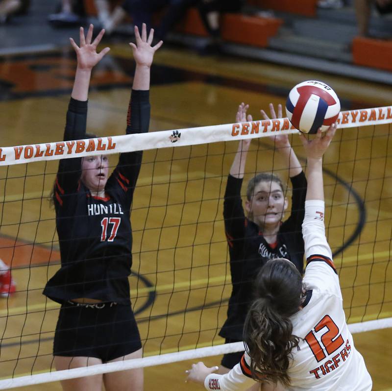 Crystal Lake Central’s Bree Hubacher, right tries to hit the ball through the block of Huntley’s Georgia Watson, left, and Emily Willis, center, during a Fox Valley Conference volleyball match Tuesday, Aug. 23, 2022, between Crystal Lake Central and Huntley at Crystal Lake Central High School.