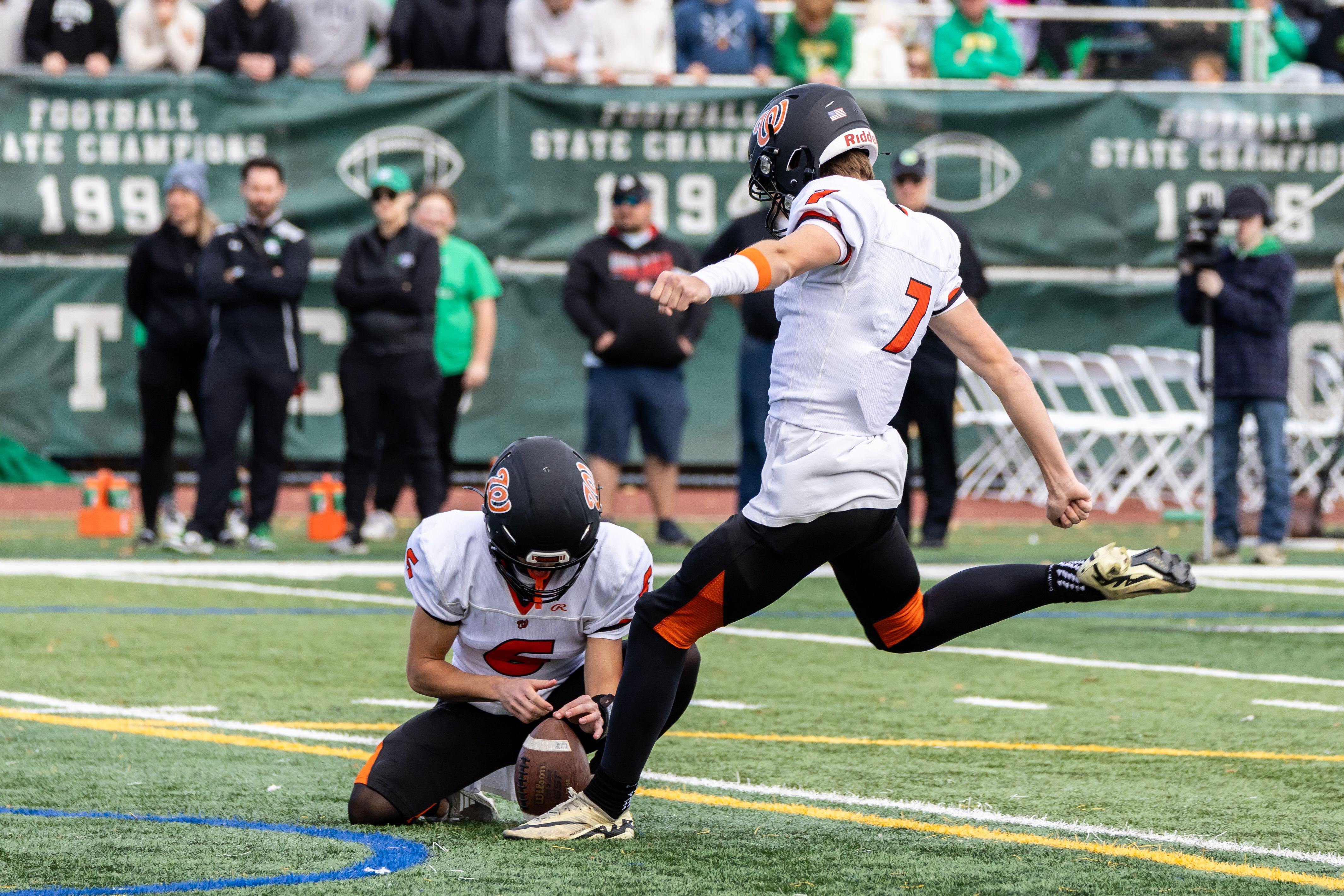 Washington's Devin Miller kicks during a 5A varsity football playoff game against Providence at Providence on Nov. 15, 2025.