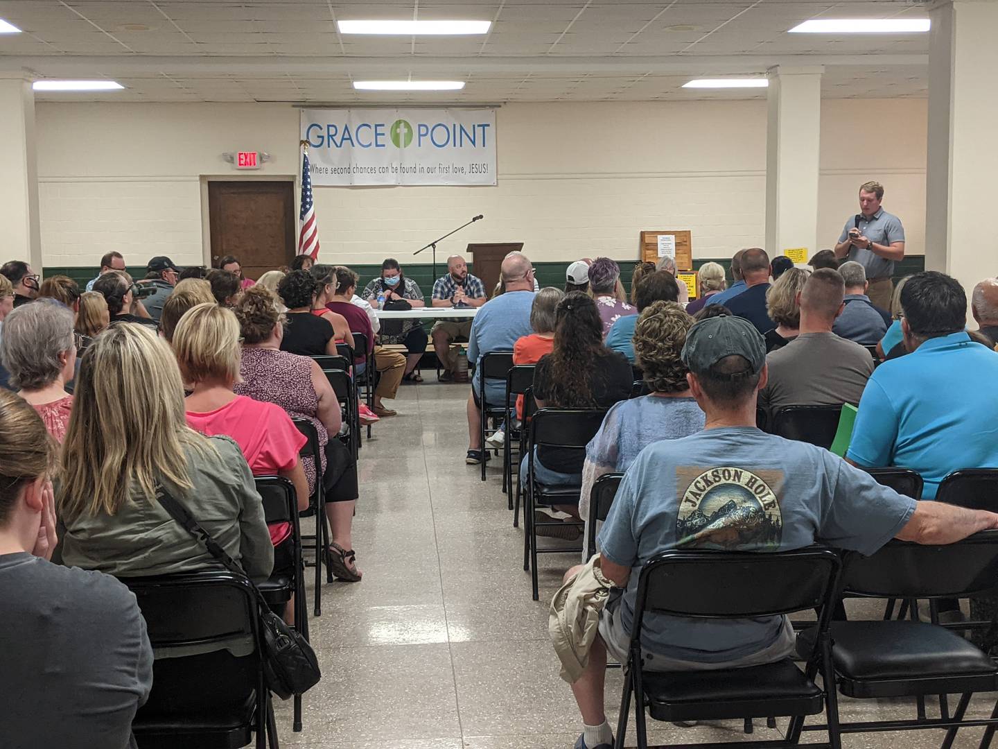 Brad Fritts, right, speaks to a crowd of more than 100 people during the Dixon Public Library Board meeting July 11, 2022.