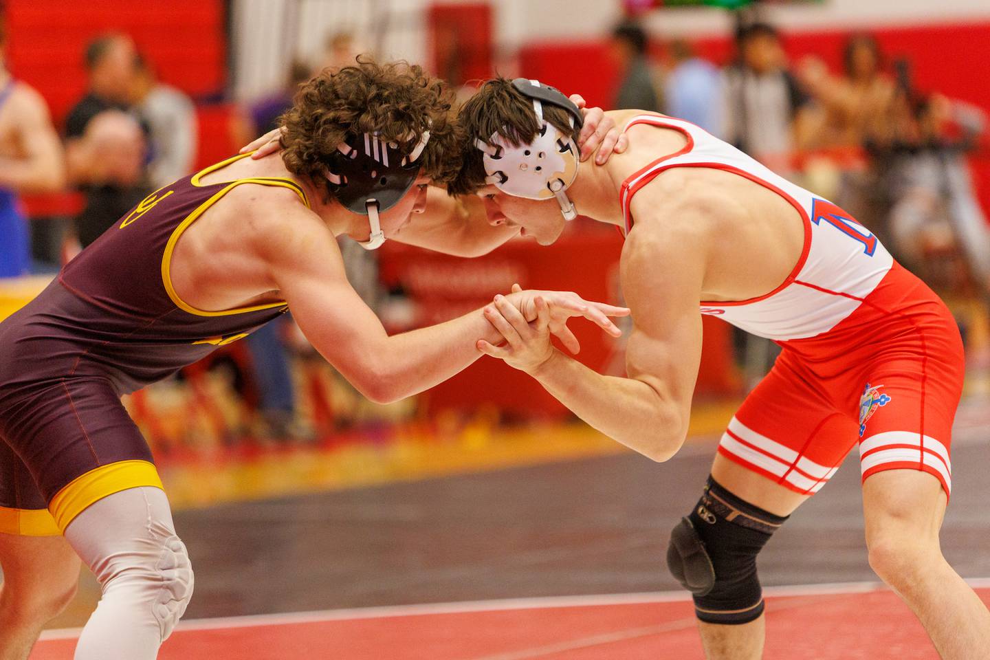 Montini's Mikey Malizzo and Marmion Academy's Nicholas Garcia competes in the 132 lb match  at the Hinsdale Central Class 3A Sectional on Saturday, Feb.14,2026 in Hinsdale.