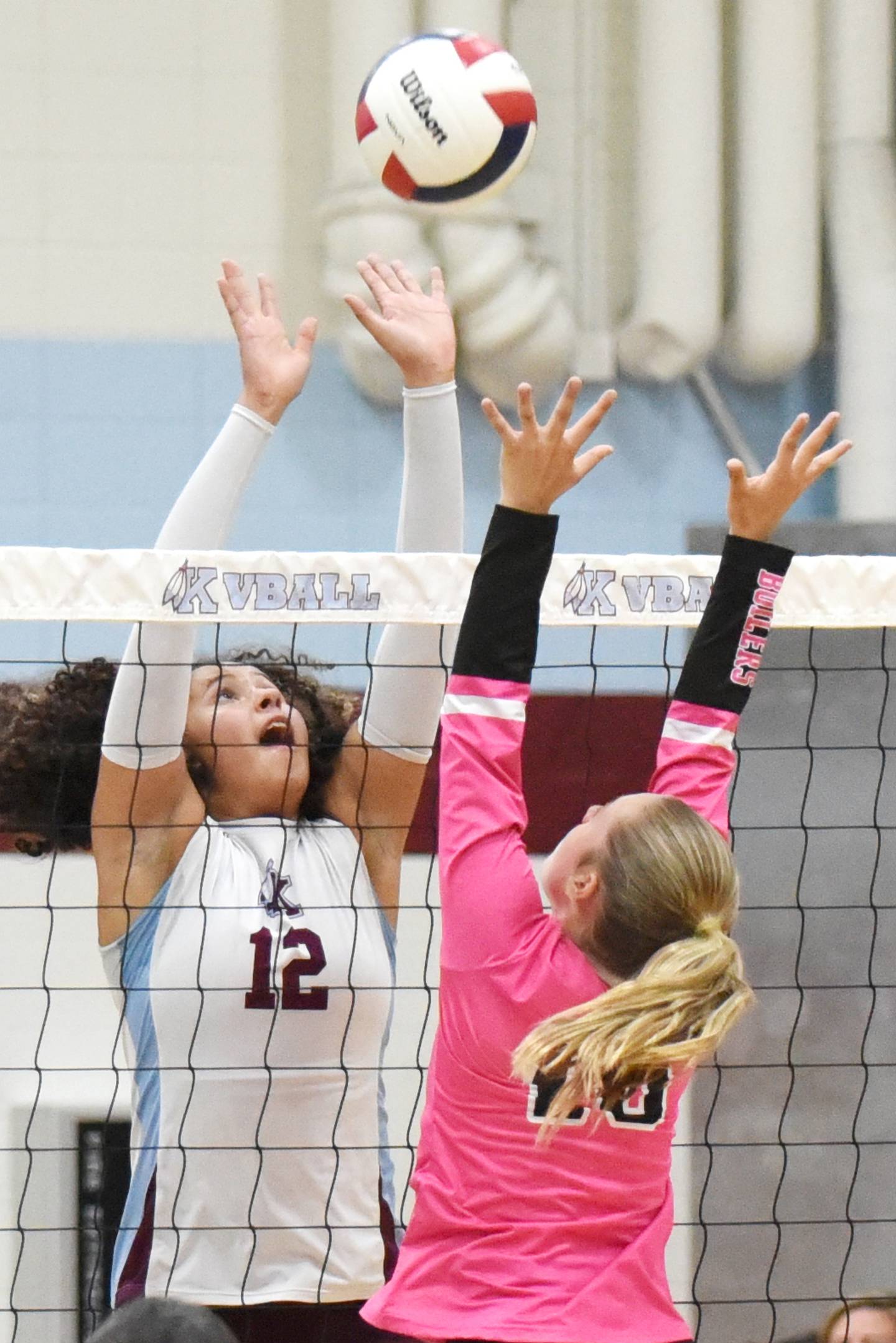 Kankakee's Malea Harrison, left, and Bradley-Bourbonnais' Harper Tollefson battle at the net during All-City action at Kankakee Tuesday, Sept. 9, 2025.