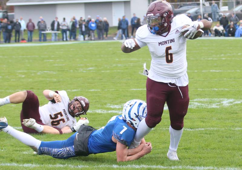 Montini Catholic's Jeremiah Peterson breaks free of a tackle by Princeton's Gavin Lanham during the Class 3A quarterfinal game on Saturday, Nov. 16, 2024 at Bryant Field in Princeton.