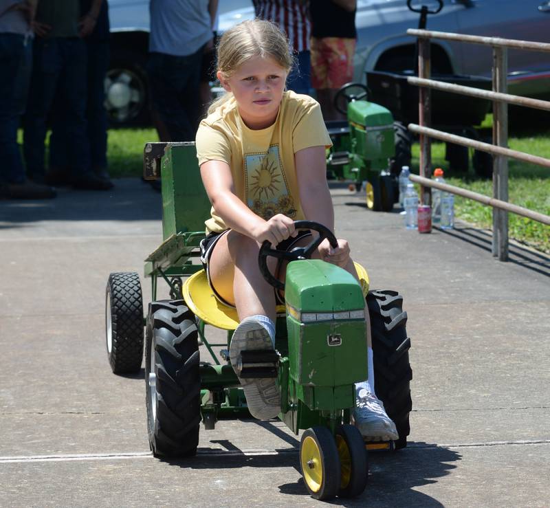 Harper Hasbrook, 9 of Annawan, competes in the pedal tractor pull at Hooppole Fun Day on Saturday, June 28, 2025.