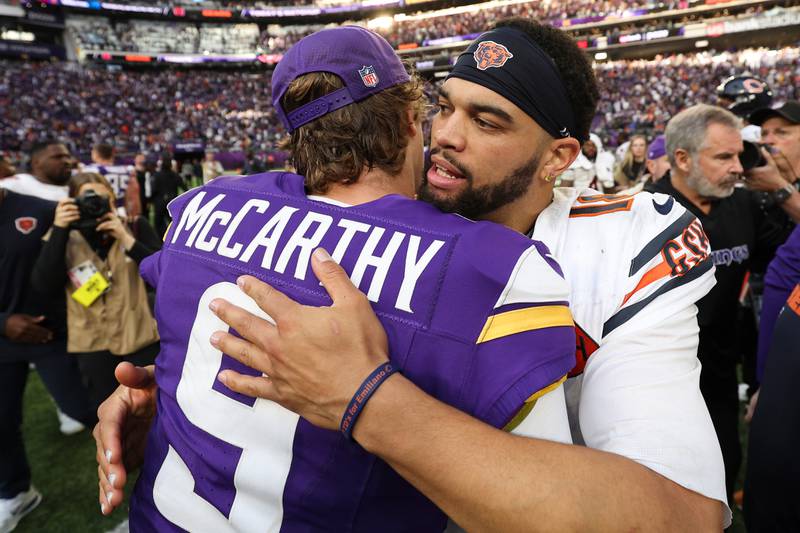 Chicago Bears quarterback Caleb Williams (18), right, hugs Minnesota Vikings quarterback J.J. McCarthy (9) after the Bears win in an NFL football game, Sunday, Nov. 16, 2025, in Minneapolis. (AP Photo/Matt Krohn)