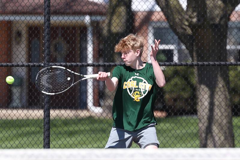 Coal City’s Jakob Boegerhausen returns a shot in his match against Joliet Catholic on Saturday, April 6, 2024 in Joliet.