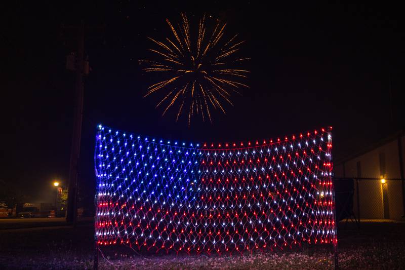 Fireworks display over American flag on Saturday, July 5, 2025 on Canal Street in Utica.