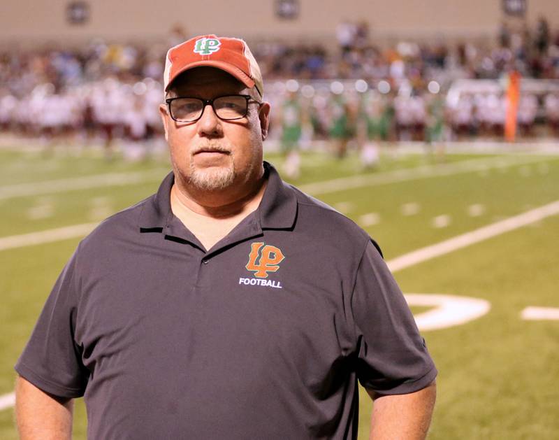L-P assistant football coach Fran Baker poses for a photo on Friday, Sept. 20, 2024 at Howard Fellows Stadium.