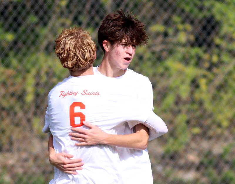 St. Charles East’s Aidan Richbell, back, and Carter Newell, #6, celebrate a Saint goal in IHSA Class 3A Regional Championship soccer at Dundee-Crown High School in Carpentersville on Saturday, October 25, 2025.