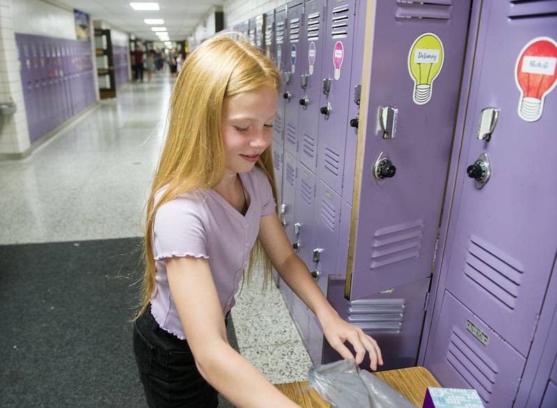 Madison School fourth grader Delaney Bock loads up her locker Monday, August 15, 2022 during a welcoming of students and parents to the Dixon school. First day of classes started earlier in the day for the Dixon district.