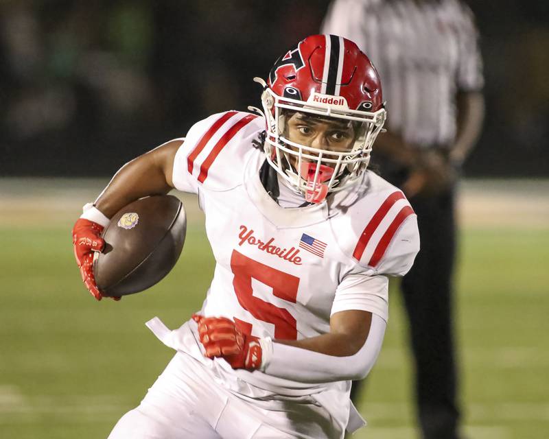 Yorkville's T.J. Harland (5) runs with the ball during football game between Yorkville at Plainfield East Friday, Sept 19, 2025 in Plainfield.