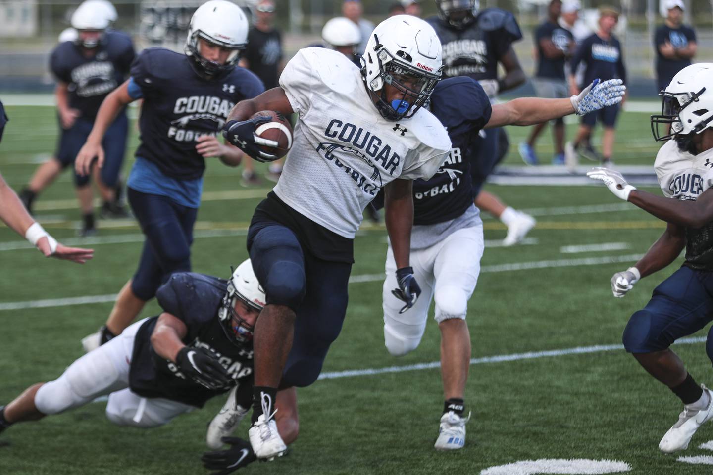 Plainfield South running back Brian Stanton breaks a tackle on Wednesday, Aug. 18, 2021, at Plainfield South High School in Plainfield, Ill.