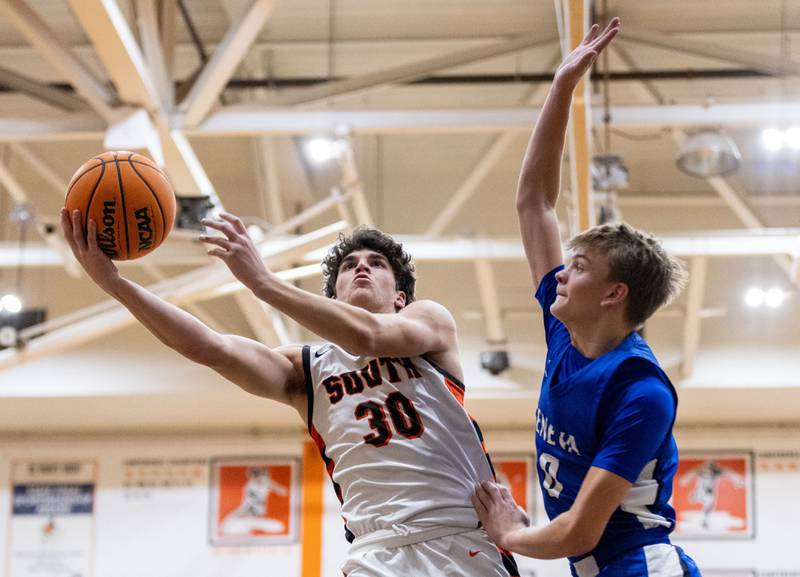 Wheaton Warrenville South’s Luca Carbonaro goes up for a layup during a home game against Geneva High School on Tuesday, Dec. 3, 2024.