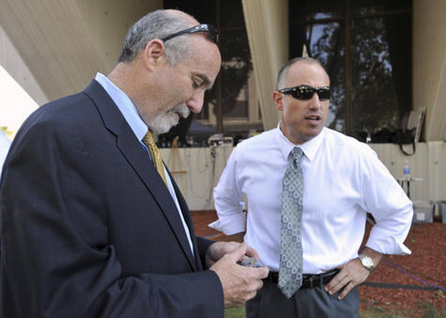 In this September 2012 file photo, Joel Brodsky (left) and Steven Greenberg, attorneys for former Bolingbrook police officer Drew Peterson, confer outside the Will County Courthouse in Joliet, during the jury deliberations in Peterson’s murder trial. Brodksy, the former lead attorney for Peterson, has filed a lawsuit claiming that Greenberg, who is still on Peterson’s legal team defamed him. The lawsuit filed in Cook County Circuit Court says Greenberg circulated a letter accusing Brodsky of “single-handedly” losing Peterson’s trial.