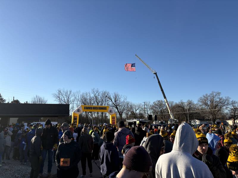 Runners gather outside before the start of the 47th annual Oglesby Turkey Trot, which drew nearly 1,300 participants despite the cold weather.