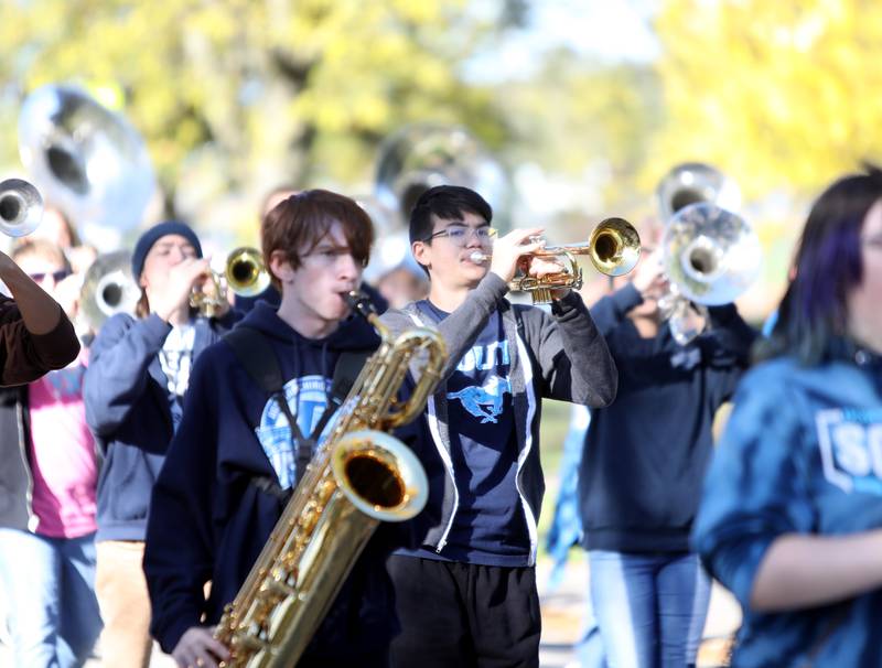 Members of the Downers Grove South marching band perform in the school’s annual homecoming parade on Friday, Oct. 20, 2023.