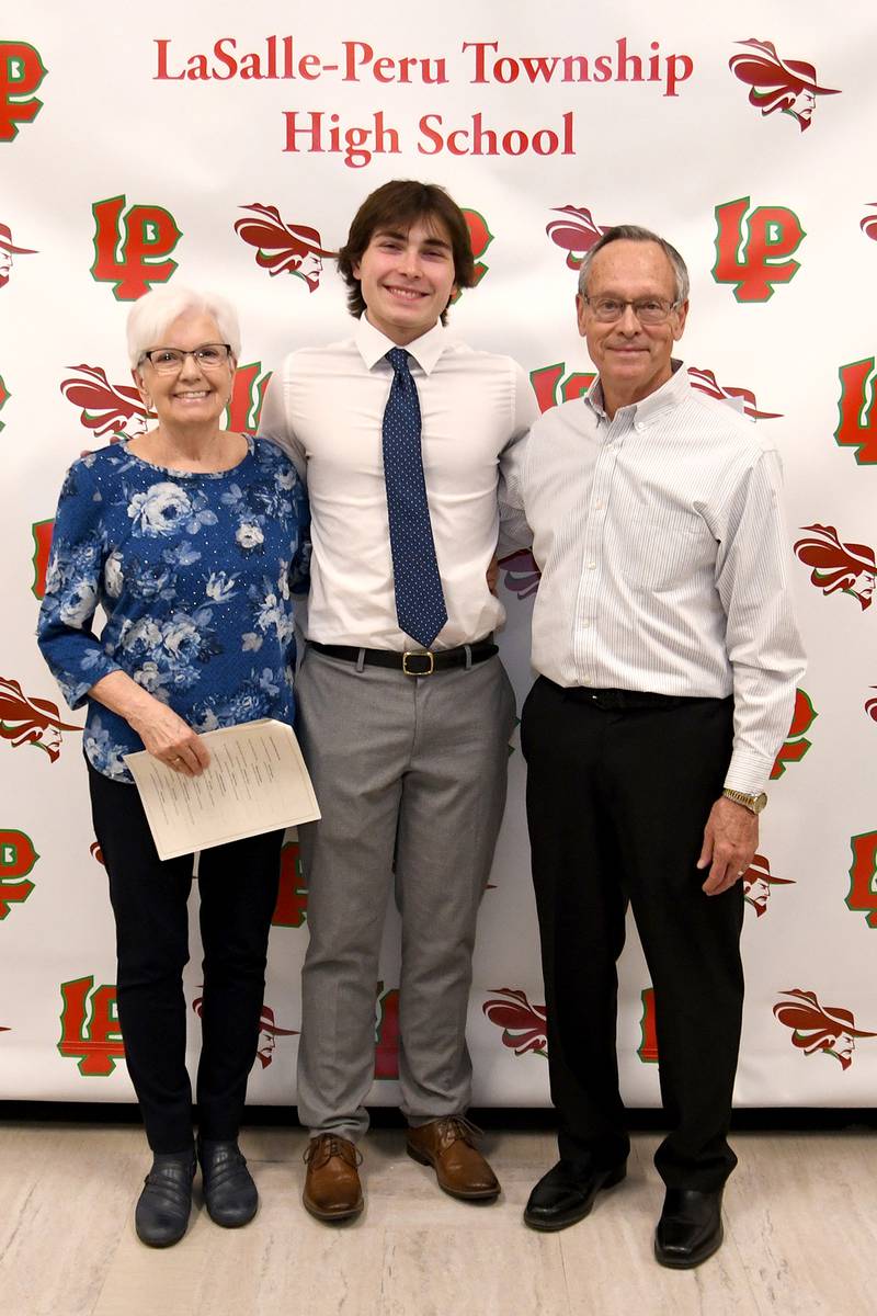 Gage Swiskoski (middle)) received the $1,000 Ken Carey Memorial Scholarship, created in honor of L-P Class of 1984 graduate Ken Carey. It is awarded to a qualified male applicant who has been involved in sports and submits an essay on the topic, "Describe your hunger to continue education beyond high school and why you are most deserving of this award." The scholarship was presented by Bonnie Huber (left) and Bob Huber (right).