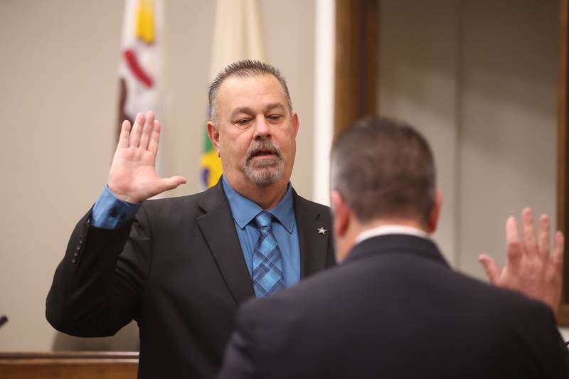 Will County Sheriff Mike Kelley is sworn in for a third term at the Will County Building in Joliet on Thursday.