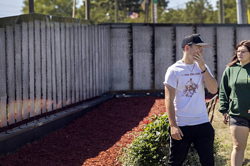 Connor Mullan and Zoe Morgan of Rock Falls vistit the Vietnam Traveling Memorial Wall Thursday, August 31, 2023. The two were a bit overwhelmed at the impact the wall made on them.