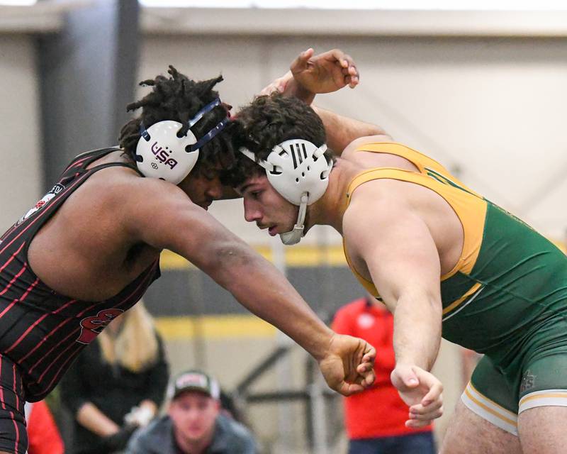 Andy Burburija, right, of Crystal Lake South competes against Lee Smith of Rockford East in the 285 weight class during the 2A sectional meet held at Sycamore High School on Saturday Feb. 10, 2024.
