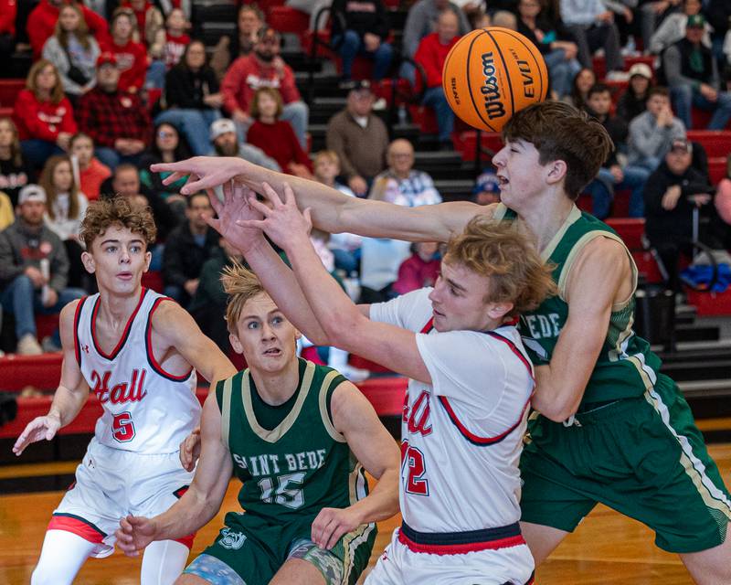 St. Bede's Graham Ross (13) is hit in head by ball after he and Hunter Edgcomb (12) of Hall battle over rebound on Saturday, January 31, 2026 at Hall High School in Spring Valley.