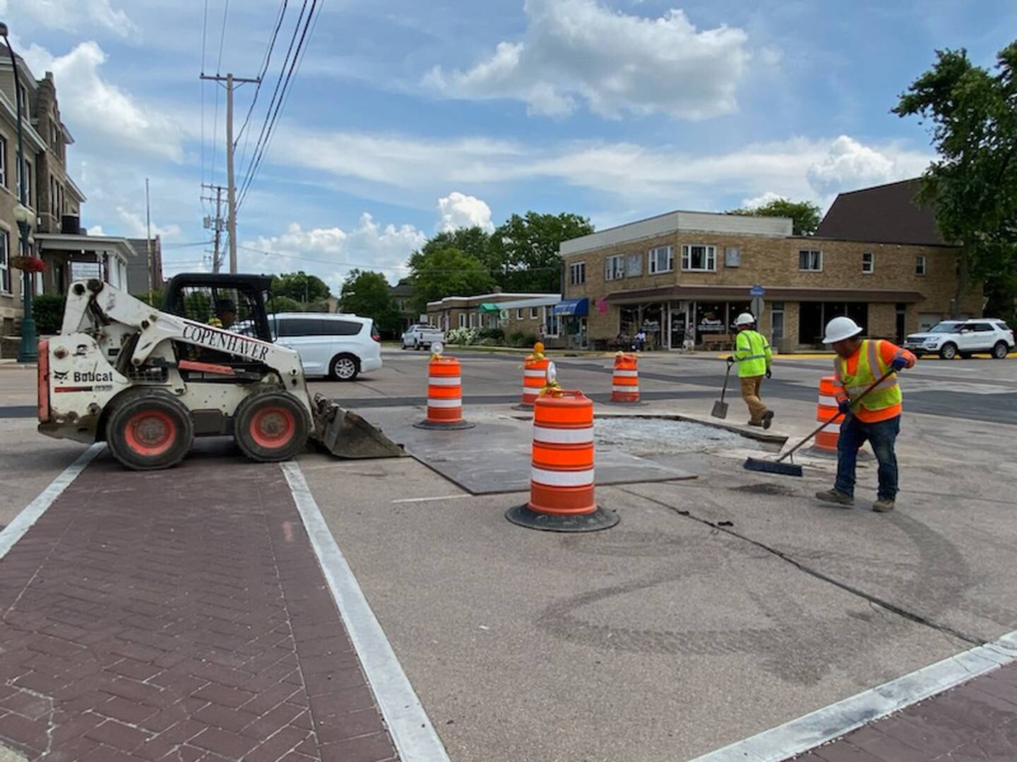 Crews work along DeKalb Avenue in Sycamore on Thursday, July 6, 2023. Water main and road work on DeKalb Avenue has been going on since mid-April 2023, with detours near downtown Sycamore at DeKalb Avenue and Cross Street.