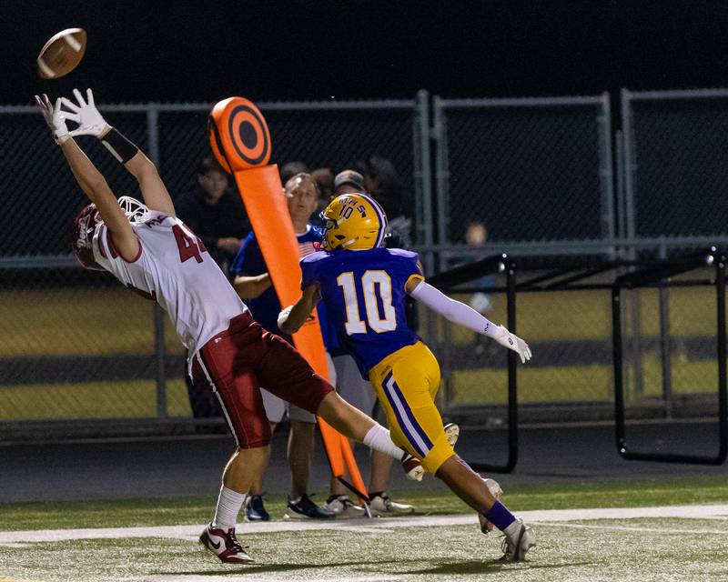 Hall High School's Chace Sterling reaches upwards in attempt to pull down a pass during the game during the game at The Jeff Prusator Athletic Complex on September 12, 2025 at Mendota High School.