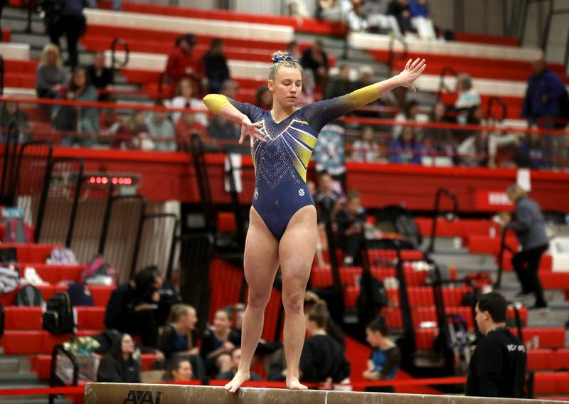 Lyons Township’s Ava Hepokoski competes on the balance beam during the Hinsdale Central Sectional on Monday, Feb. 10, 2025 in Hinsdale.