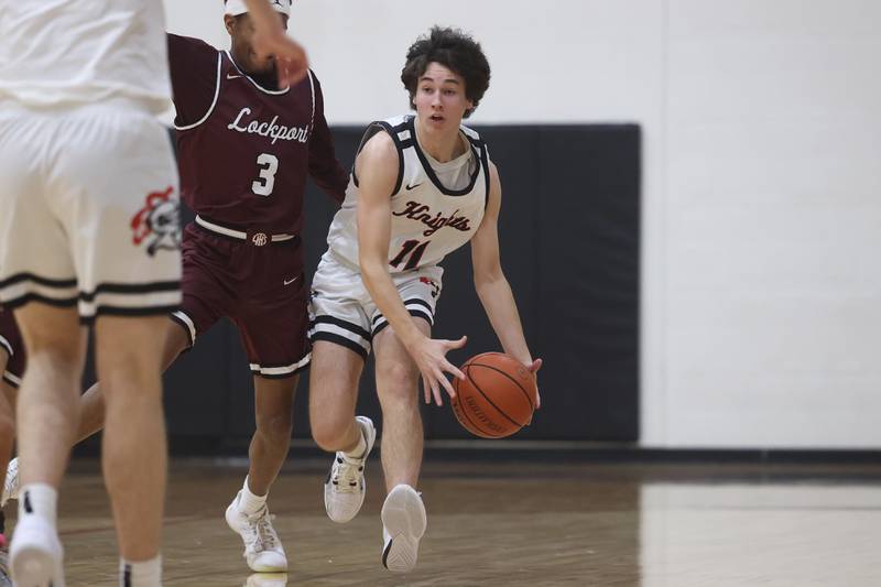 Lincoln-Way Central’s Kevin Barrett works the ball upcourt against Lockport on Tuesday, Jan. 23rd, 2024 in New Lenox.