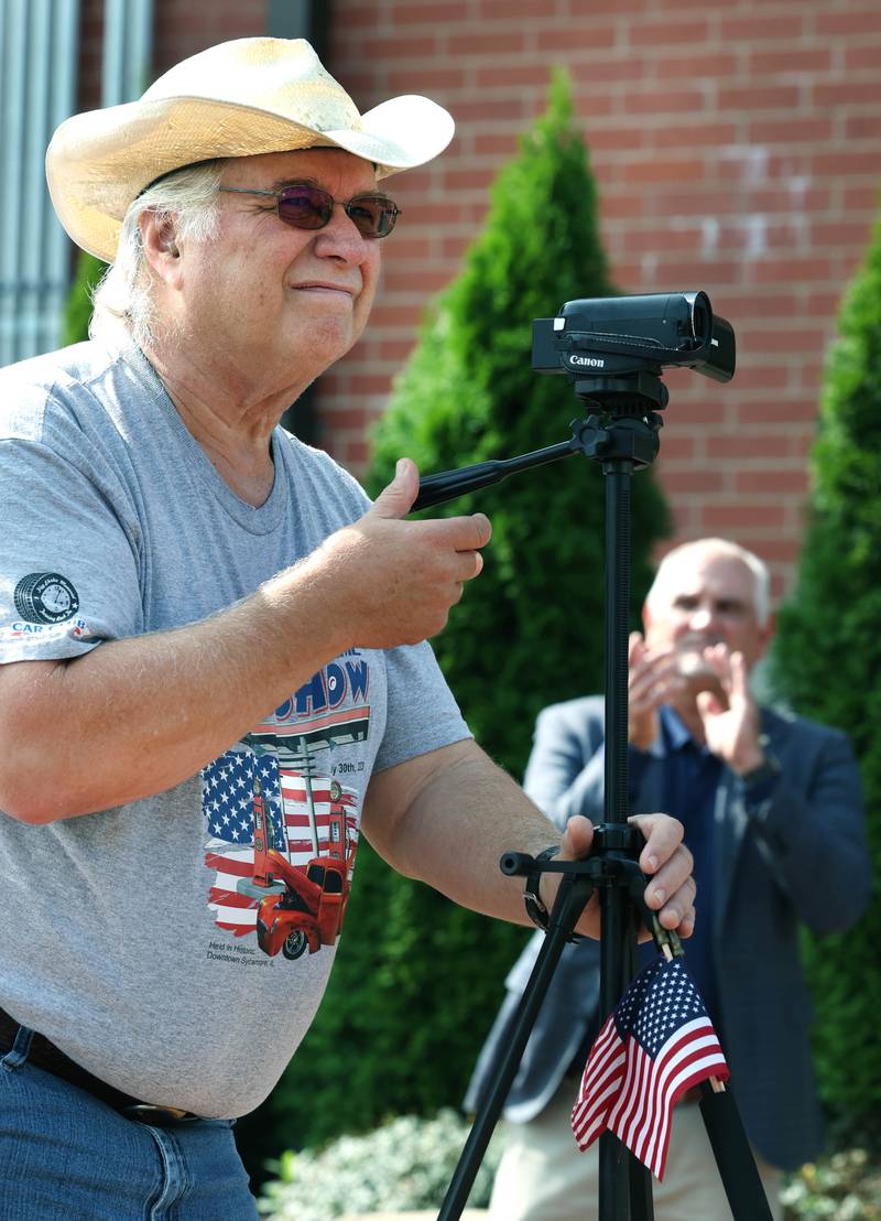 Mike Tritle, from DeKalb, shoots video Thursday, Aug. 22, 2024, during the DeKalb Veterans Memorial Mural dedication in Van Buer Plaza in DeKalb. Tritle captures the stories of veterans on video during at community events in the area.
