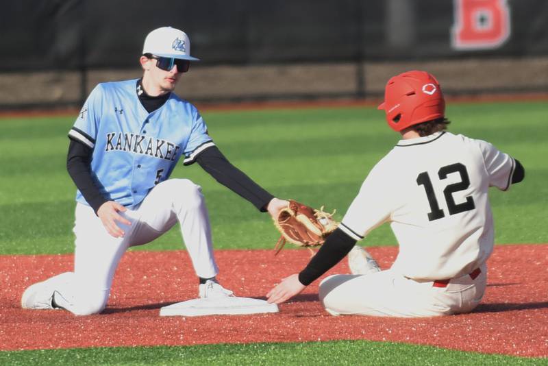 Kankakee's Bryce Deany, left, attempts to tag Bradley-Bourbonnais' Cooper Daugherty out at second base during a game at 315 Sports Park in Bradley Friday, March 27, 2026.
