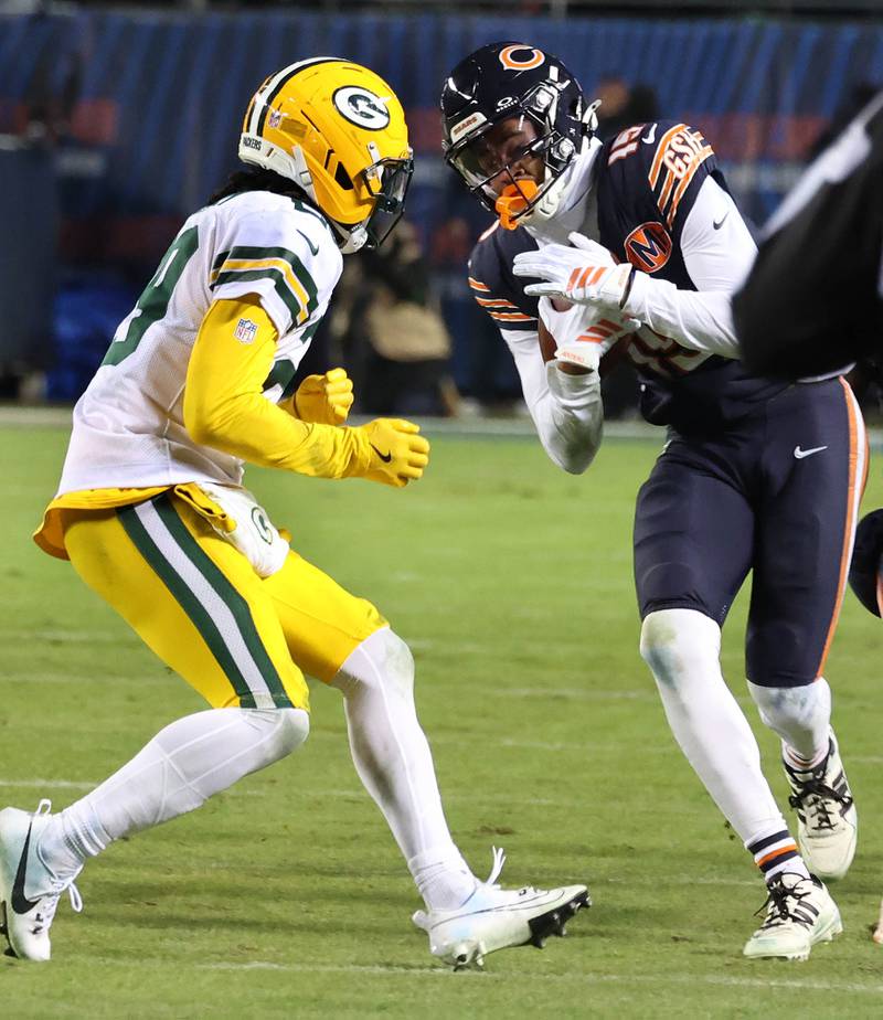 Chicago Bears wide receiver Rome Odunze looks to get by Green Bay Packers safety Xavier McKinney during their NFL Wild Card game Saturday, Jan. 10, 2026, at Soldier Field in Chicago.
