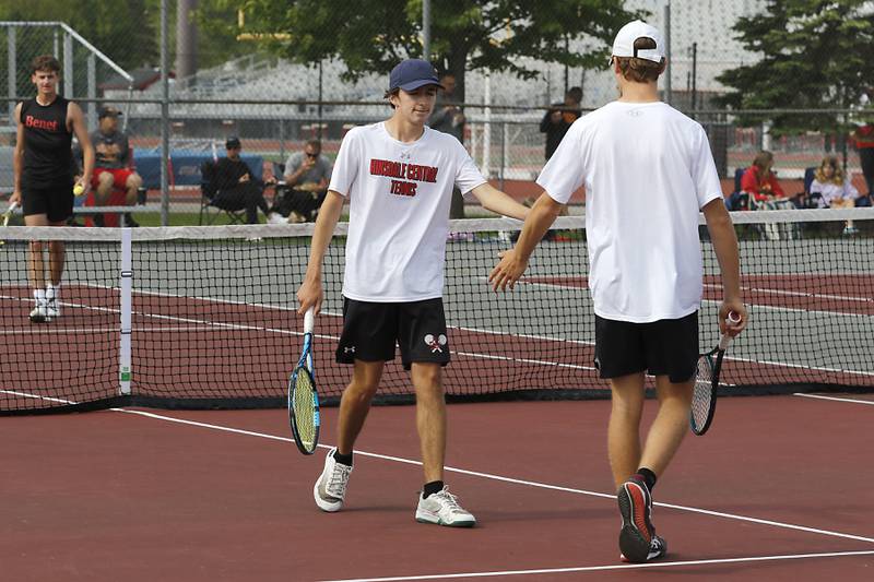 Hinsdale Central’s Nicholas Marringa talks to  his doubles partner, Kyle McClain, as they compete in the Class 2A Boys State Tennis Tournament on Thursday, May 29, 2025, at Palatine High School.