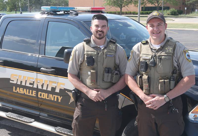 Sheriffs and police chiefs once had difficulty finding new police recruits. Not anymore. La Salle County Sheriff's Deputies Riley Pode and Corbin Flynn, posing Wednesday, July 2, 2025, at the La Salle County Government Complex in Ottawa, are among the new officers who have reversed the trend. Pay increases and a more favorable view by the public have boosted police recruiting.