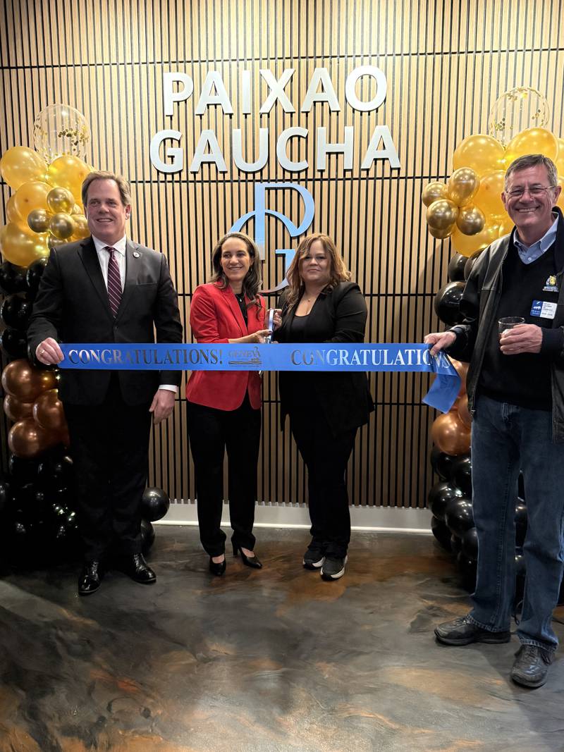 The Geneva Chamber of Commerce celebrating Paixao Gaucha Brazilian Steakhouse's grand opening.