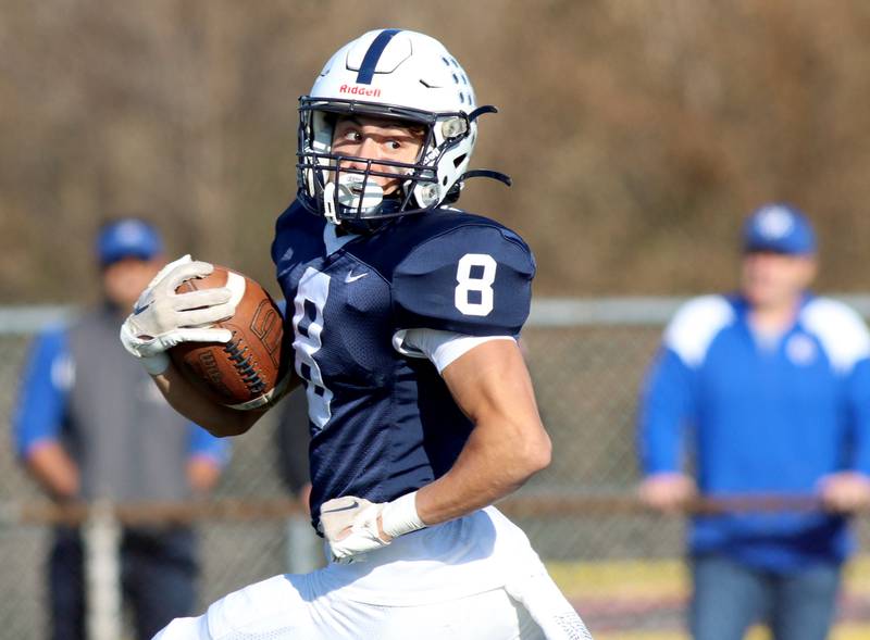 Cary-Grove’s Andrew Prio breaks free for a lengthy touchdown run against Geneva in IHSA Class 6A quarterfinal playoff football action at Cary Saturday.