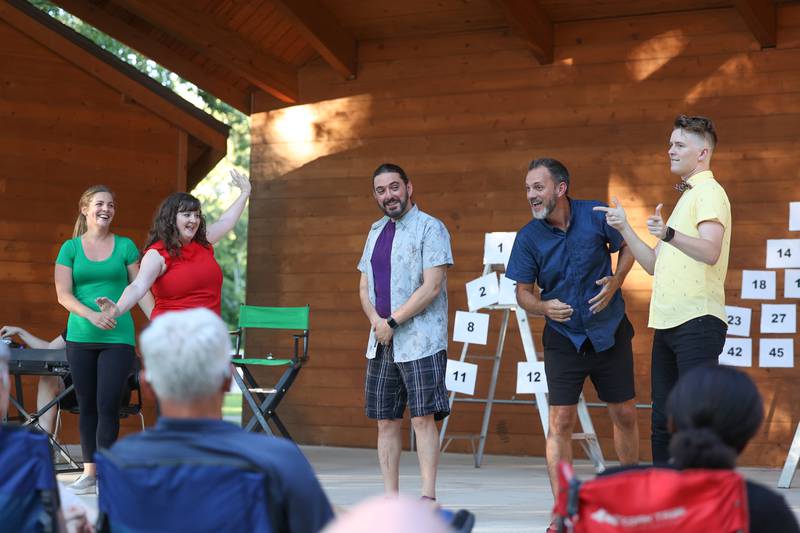 The cast of GreenRoom Improv interacts with the crowd during the improv show hosted by the Morris Library at Goold Park on Friday, Aug. 11, 2023 in Morris.