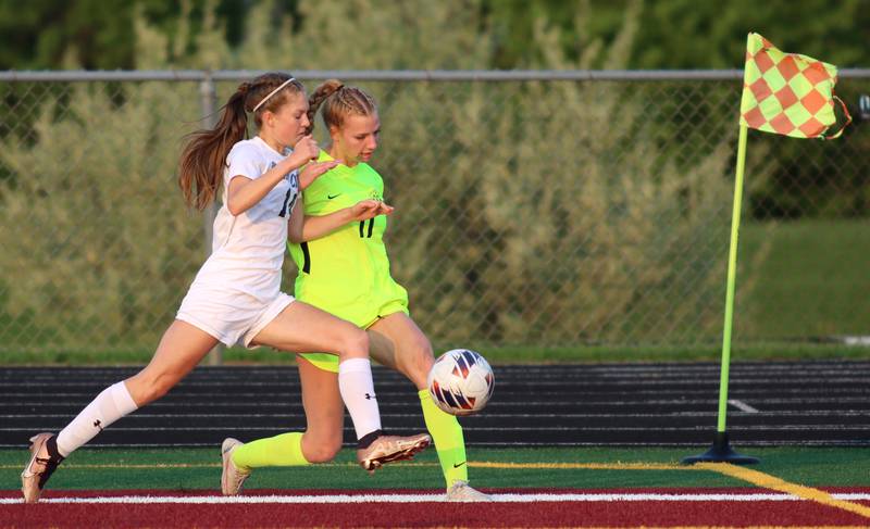 Richmond-Burton’s Margaret Slove, right, battles Willows’ Julia Lechner in Class 1A Sectional title soccer action at Richmond Friday night.