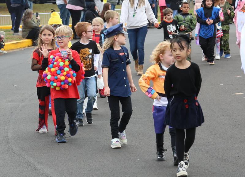 Students from Jefferson Elementary walk around the school during a Halloween parade on Friday, Oct. 31, 2025 in Princeton.