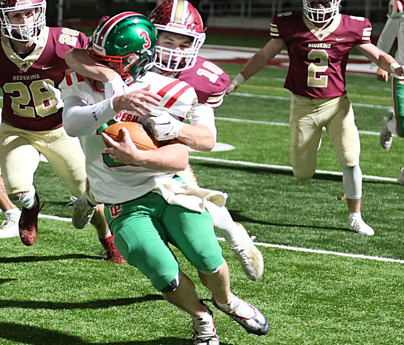 Morris's Sam Mateski (10) brings down L-P's Mason Lynch (3) from behind during the Class 5A round one football game on Friday, Oct. 28, 2022 in Morris.