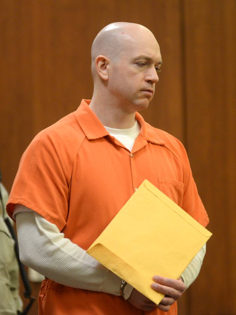 Matthew Plote of Malta is escorted into an Ogle County courtroom on Wednesday, Dec. 6, 2023. He is charged with killing Melissa Lamesch of Mt. Morris and her unborn son in November 2020 before setting her Mt. Morris home on fire. He has pled not guilty to the charges.