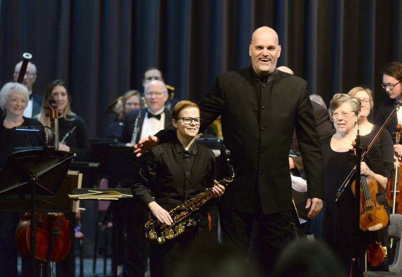 Rileigh Wren was all smiles as she received a standing ovation after her performance with the Clinton Symphony Orchestra during the Family Concert on Sunday, Feb. 23, 2025 in the Morrison High School Auditorium. Here, Wren is presented to the audience by Brian Dollinger, the symphony's music director and conductor.