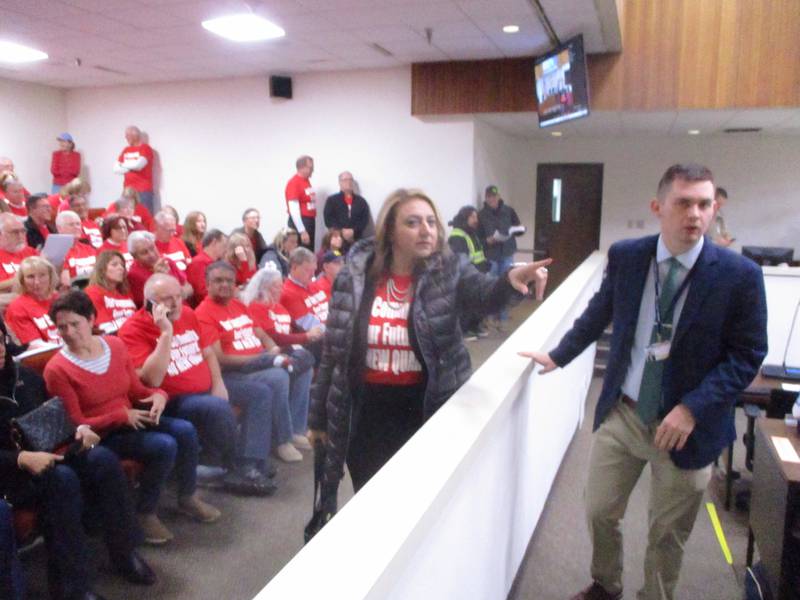 Bolingbrook Mayor Mary Alexander-Basta talks with Will County Board Member Mark Revis before the Thursday meeting that included a vote on the AZ Rock quarry. March 20, 2025