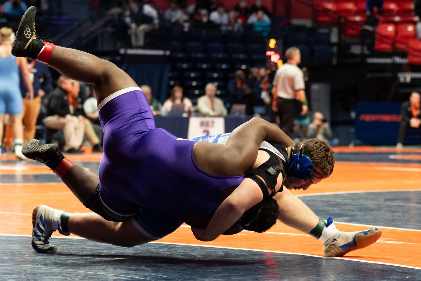 Princeton senior Cade Odell (top) wrestles during the IHSA Class 1A state tournament on Saturday, Feb. 22, 2025 in Champaign.