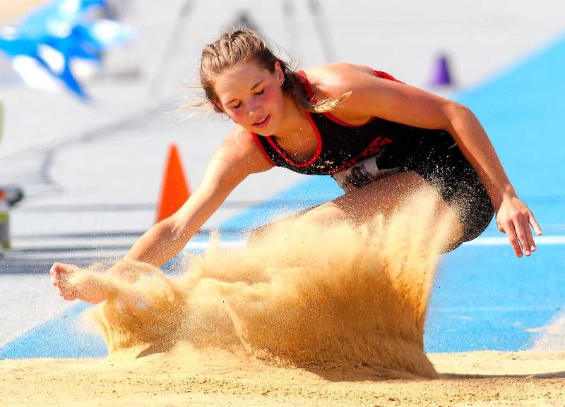 June 10, 2021 - Charleston, Illinois - Amboy's Elly Jones lands in the sand pit during the Class 1A Triple Jump at the Illinois High School Association Track & Field State Finals.  (Photo: PhotoNews Media/Clark Brooks)