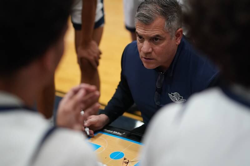 Oswego East's head coach Ryan Velasquez during a hoops for healing tournament basketball game against Hinsdale Central at Oswego East High School on Tuesday, Nov. 26, 2024.